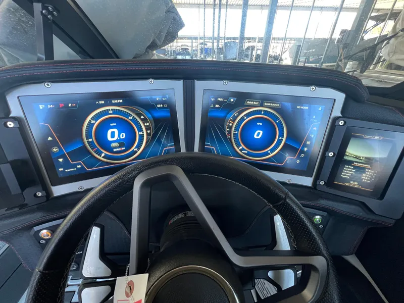 Slide: The Image of 2022 Centurion Ri230 dashboard with dual digital displays and steering wheel. - 8