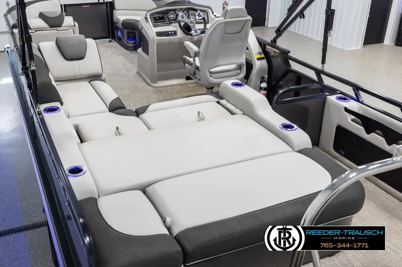 Slide: The Image of 2021 Avalon LSZ VRB boat interior with luxurious seating and modern dashboard. - 10