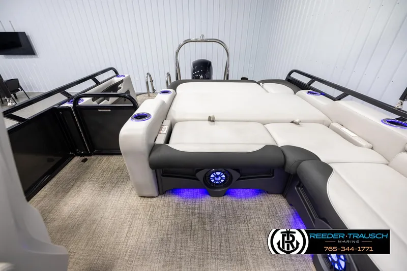 Slide: The Image of 2021 Avalon LSZ VRB pontoon boat interior with plush seating and blue LED lighting. - 14