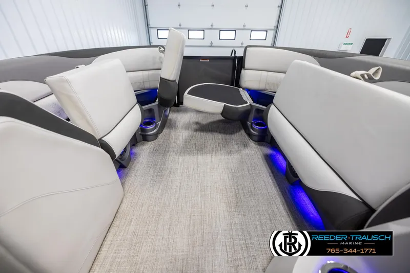Slide: The Image of Interior of 2021 Avalon LSZ VRB boat with plush seating and blue LED lighting. - 18