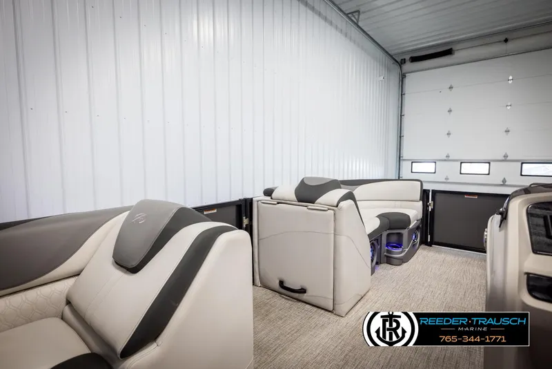 Slide: The Image of 2021 Avalon LSZ VRB boat interior with modern seating in a garage setting. - 19