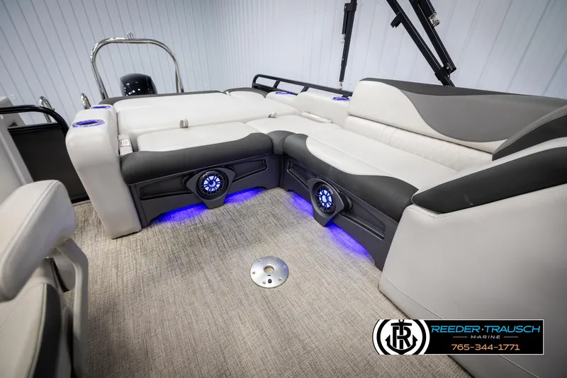 Slide: The Image of 2021 Avalon LSZ VRB boat interior with plush seating and blue LED lighting. - 21