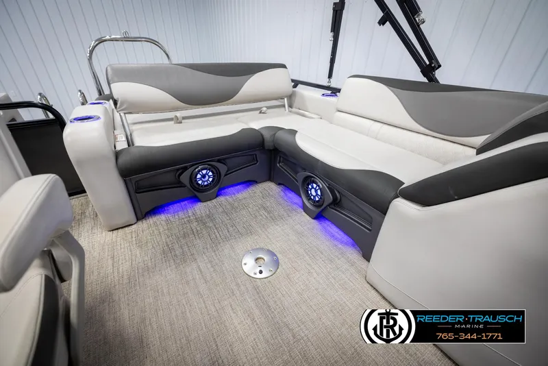 Slide: The Image of 2021 Avalon LSZ VRB boat interior with plush seating and blue LED lighting. - 22