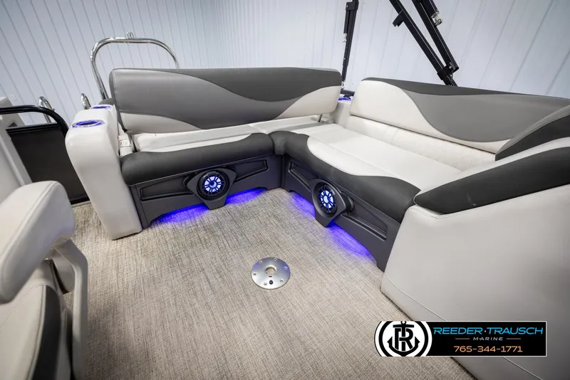 Slide: The Image of 2021 Avalon LSZ VRB boat interior with plush seating and blue LED lighting. - 23