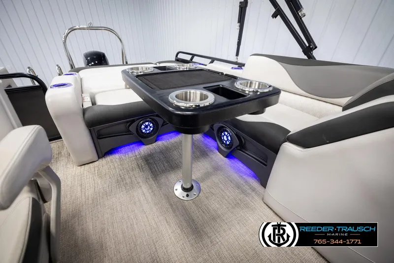 Slide: The Image of 2021 Avalon LSZ VRB boat interior with seating, table, and blue LED lighting. - 24