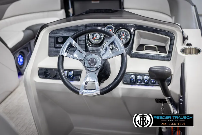 Slide: The Image of 2021 Avalon LSZ VRB boat dashboard with steering wheel and control panel. - 26