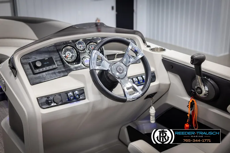 Slide: The Image of 2021 Avalon LSZ VRB boat dashboard with steering wheel and controls. - 27