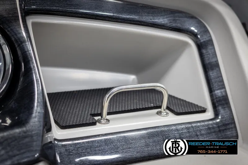 Slide: The Image of 2021 Avalon LSZ VRB dashboard compartment with handle, featuring sleek design and Reeder-Trausch branding. - 34