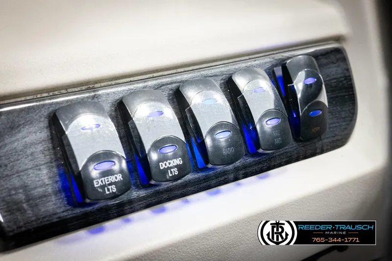 Slide: The Image of Control panel with illuminated switches for exterior and docking lights on a 2021 Avalon LSZ VRB. - 35