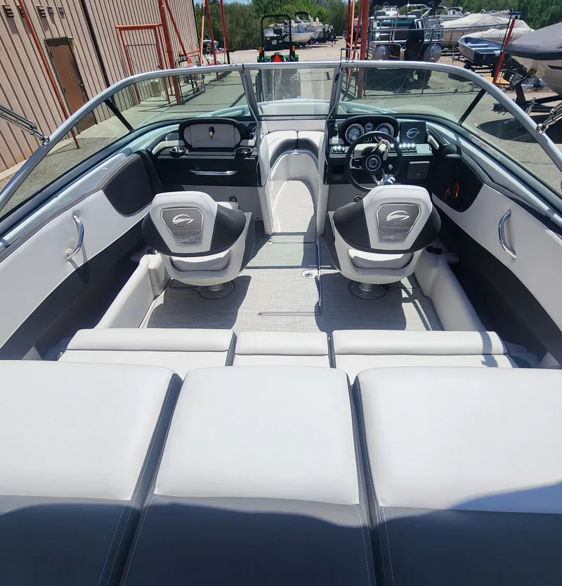 Slide: The Image of 2024 Crownline 200SS boat interior with modern seating and dashboard design. - 10