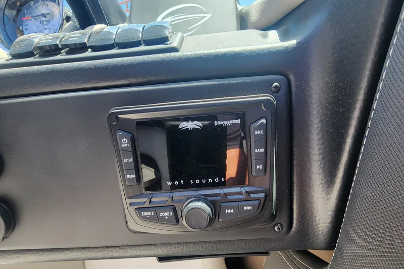 Slide: The Image of 2024 Crownline 200SS boat dashboard with Wet Sounds audio system. - 14