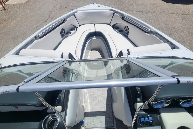 Slide: The Image of 2024 Crownline 200SS boat interior with sleek seating and modern design. - 7