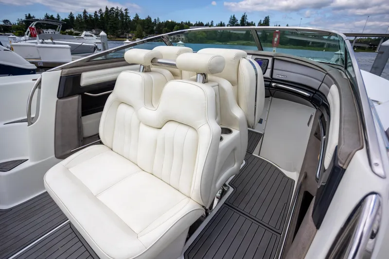 Slide: The Image of Luxury interior of 2005 Cobalt 343 boat with white leather seats and sleek design. - 10