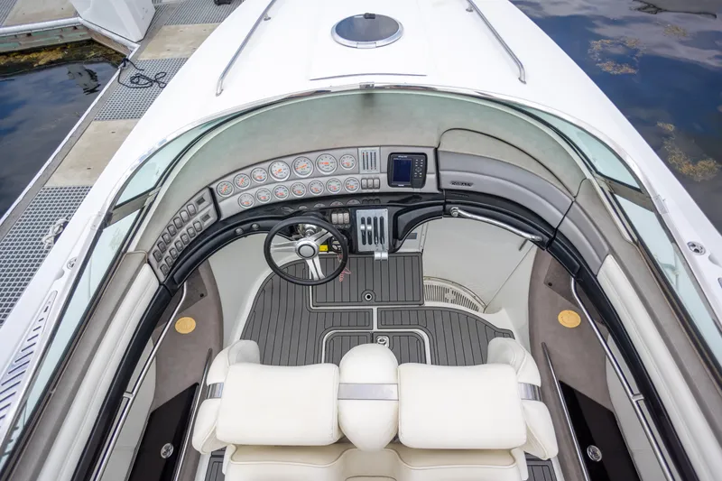 Slide: The Image of 2005 Cobalt 343 boat cockpit with modern dashboard and steering wheel. - 12