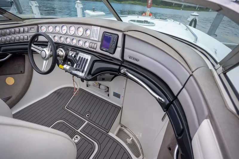 Slide: The Image of Interior cockpit of a 2005 Cobalt 343 boat with steering wheel and control panel. - 15