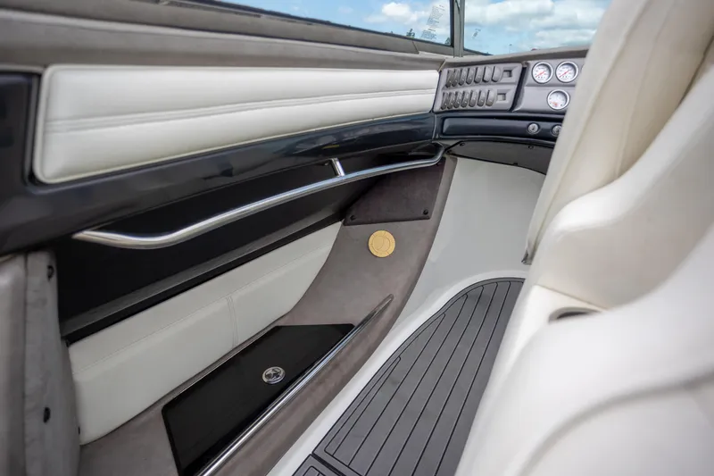 Slide: The Image of 2005 Cobalt 343 interior with sleek dashboard, white seating, and modern controls. - 18