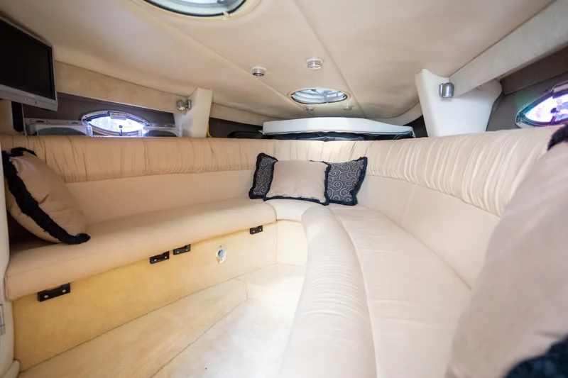 Slide: The Image of Luxurious interior of a 2005 Cobalt 343 boat with plush seating and pillows. - 19