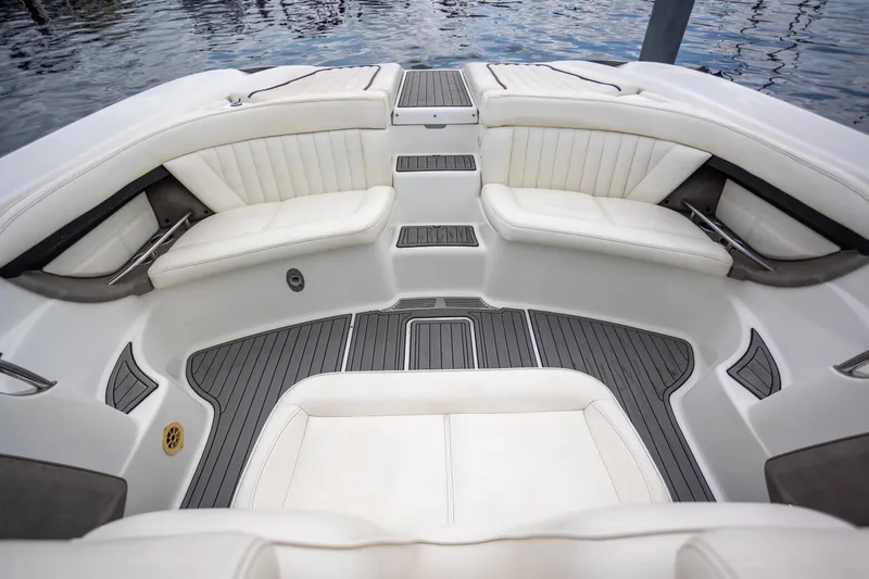 Slide: The Image of Luxurious interior of a 2005 Cobalt 343 boat with white seating and sleek design. - 6