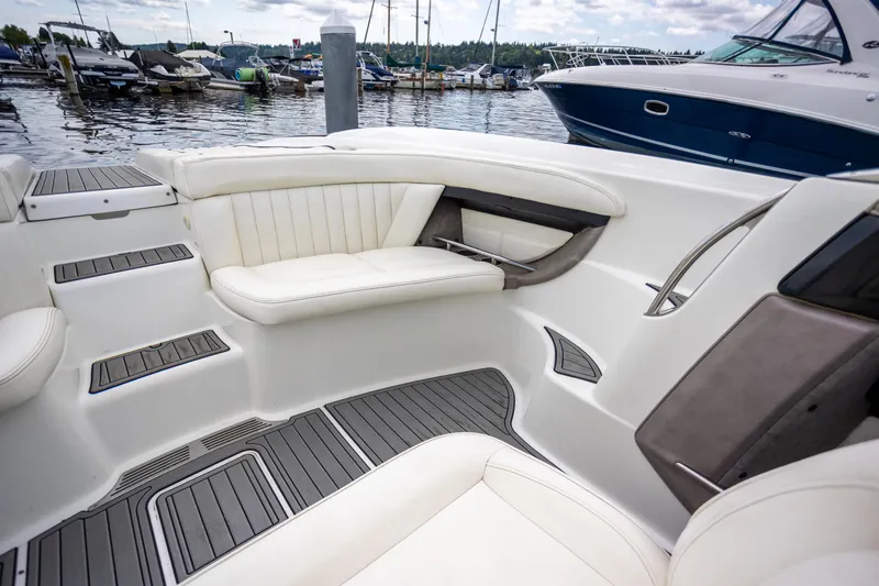 Slide: The Image of Luxurious interior of a 2005 Cobalt 343 boat with white seating and sleek design. - 7