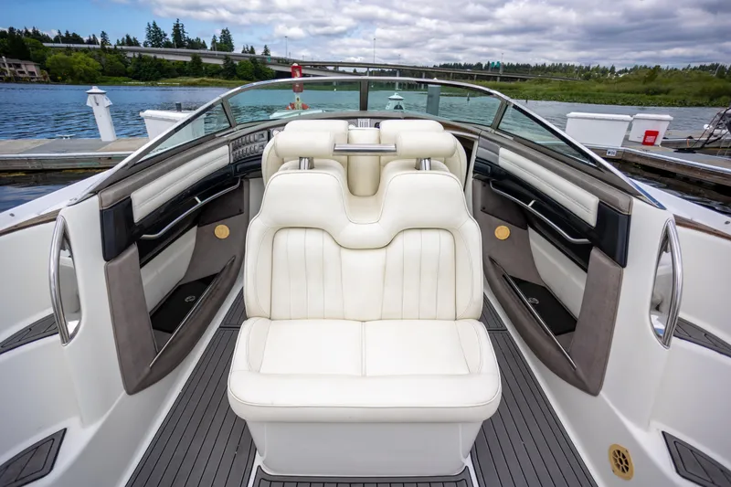 Slide: The Image of Luxury interior of 2005 Cobalt 343 boat with white leather seating and scenic water view. - 9
