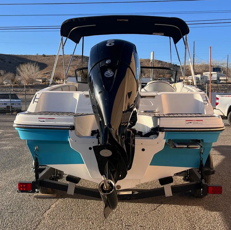 Slide: The Image of 2024 Bayliner VR40B boat with outboard motor, parked on a trailer, rear view. - 3