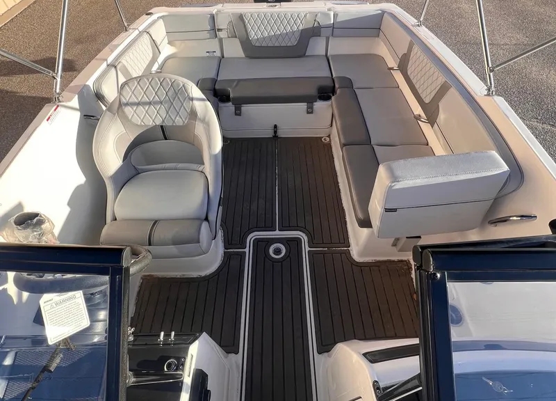Slide: The Image of 2024 Bayliner VR40B boat interior with luxurious seating and sleek design. - 7