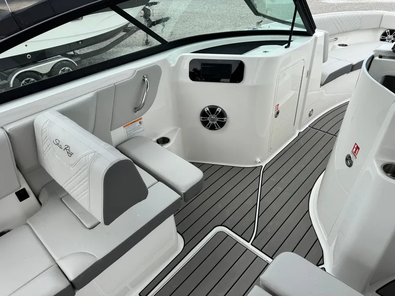 Slide: The Image of 2025 Sea Ray SDX 250 boat interior with sleek seating and modern dashboard. - 12