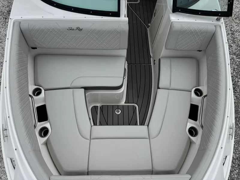 Slide: The Image of 2025 Sea Ray SDX 250 boat interior with spacious seating and cup holders. - 18