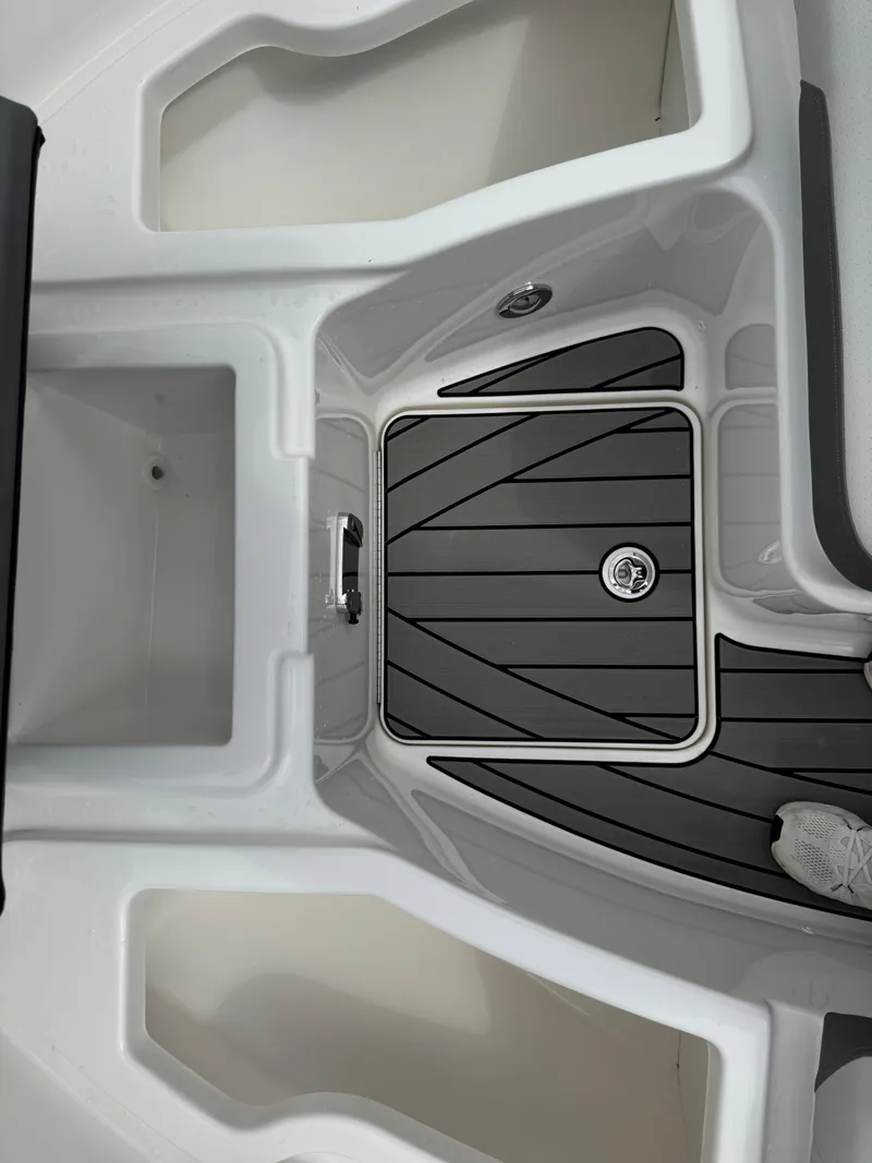 Slide: The Image of 2025 Sea Ray SDX 250 boat interior with sleek black and white design. - 21