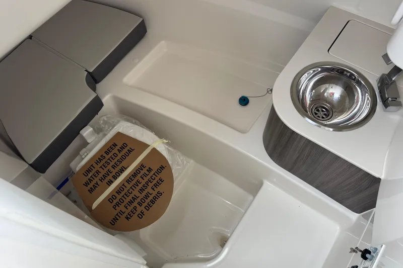 Slide: The Image of 2025 Sea Ray SDX 250 boat interior with sink and seating area. - 25