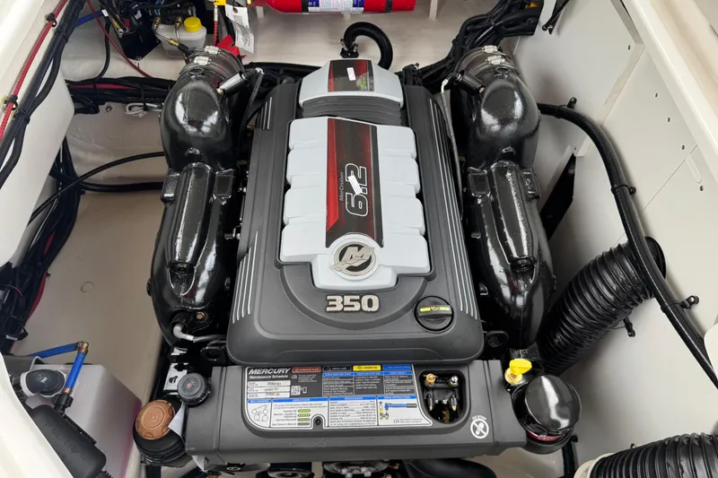 Slide: The Image of 2025 Sea Ray SDX 250 engine compartment featuring a powerful Mercury 6.2L 350 HP engine. - 26