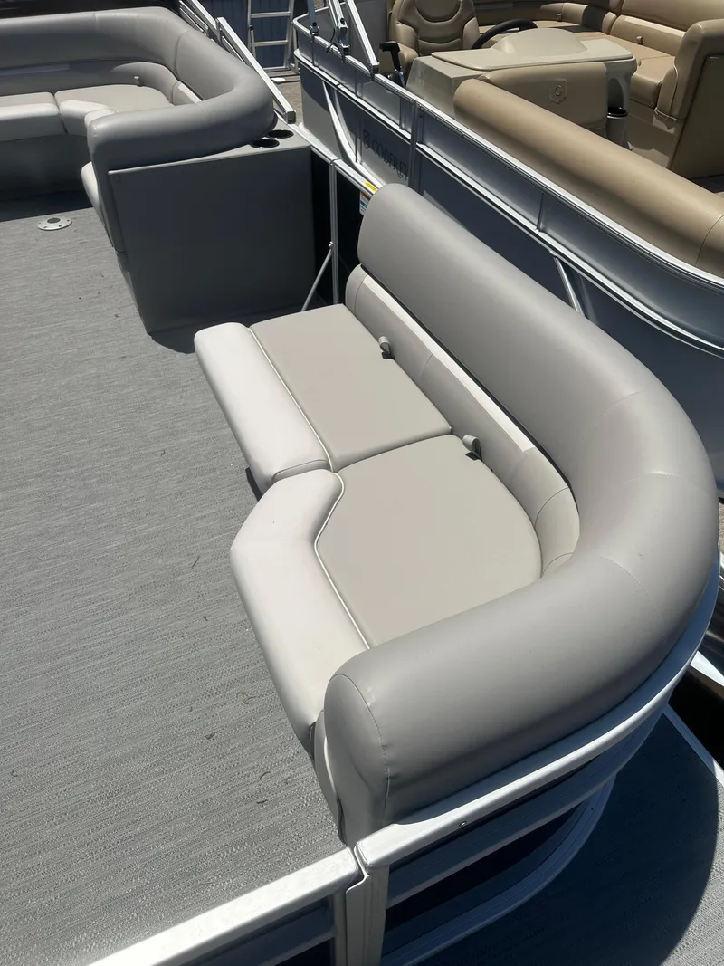 Slide: The Image of 2025 Godfrey 2086 CPX Sport-Tube Tritoon with gray seating and spacious deck. - 10