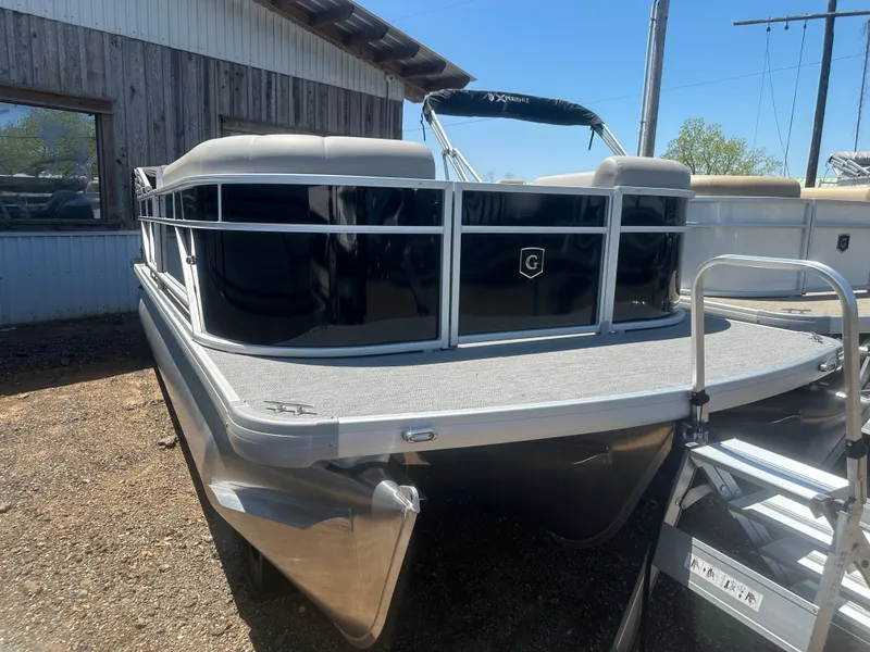 Slide: The Image of 2025 Godfrey 2086 CPX Sport-Tube Tritoon boat, docked outdoors, side view. - 3