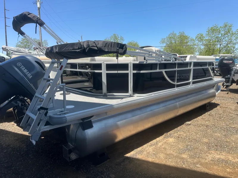 Slide: The Image of 2025 Godfrey 2086 CPX Sport-Tube Tritoon boat with Yamaha engine, parked outdoors. - 5