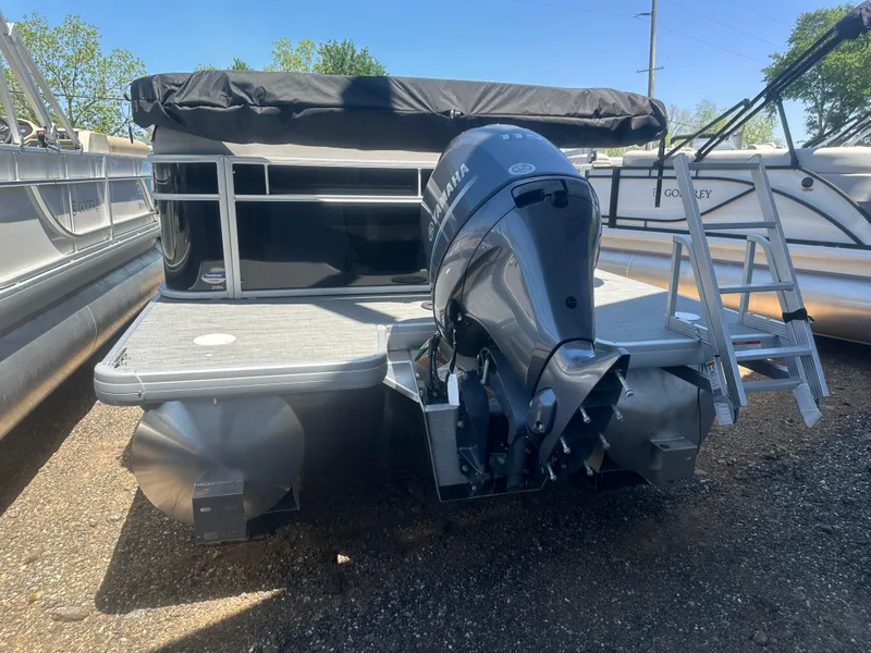 Slide: The Image of 2025 Godfrey 2086 CPX Sport-Tube Tritoon with Yamaha outboard motor, parked on gravel. - 7