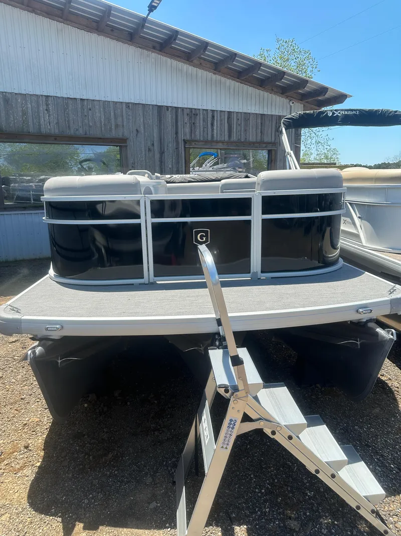 Slide: The Image of 2025 Godfrey 2086 CPX Sport-Tube Tritoon boat with ladder, parked outdoors. - 8
