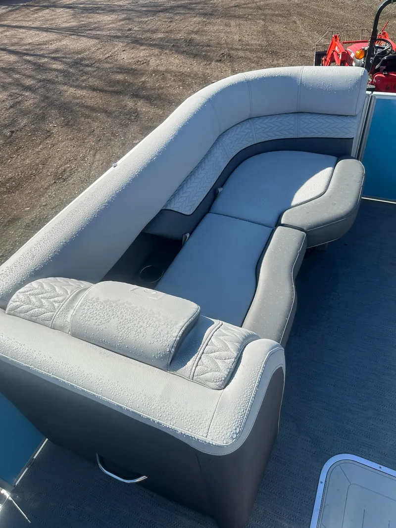 Slide: The Image of 2025 Godfrey Monaco 235 DFL Tritoon with luxurious seating and modern design. - 13