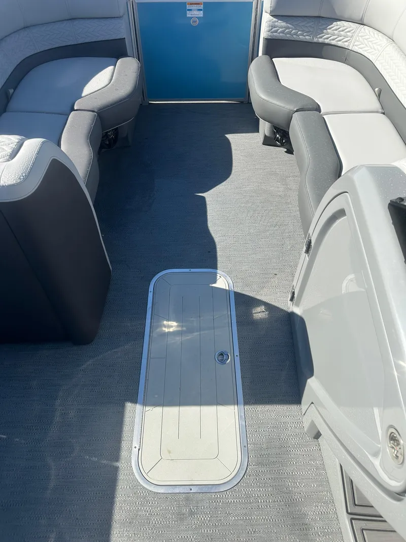 Slide: The Image of Interior of 2025 Godfrey Monaco 235 DFL Tritoon, featuring spacious seating and modern design. - 15