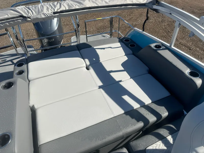 Slide: The Image of 2025 Godfrey Monaco 235 DFL Tritoon with spacious sun deck and cup holders. - 21