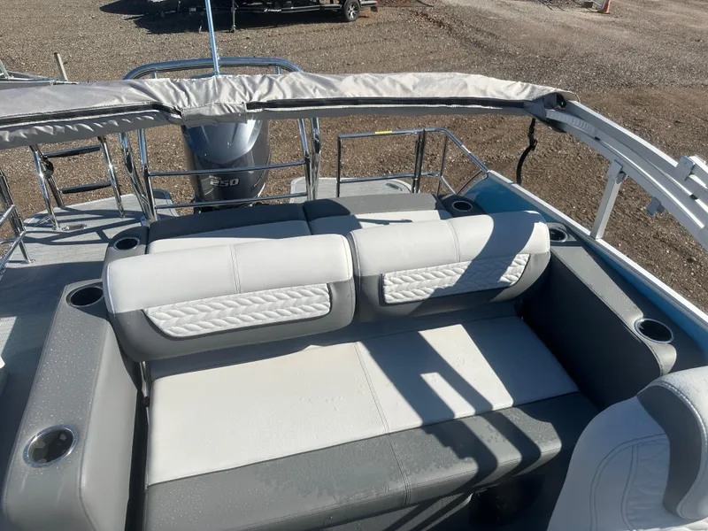 Slide: The Image of 2025 Godfrey Monaco 235 DFL Tritoon with spacious seating and modern design. - 23