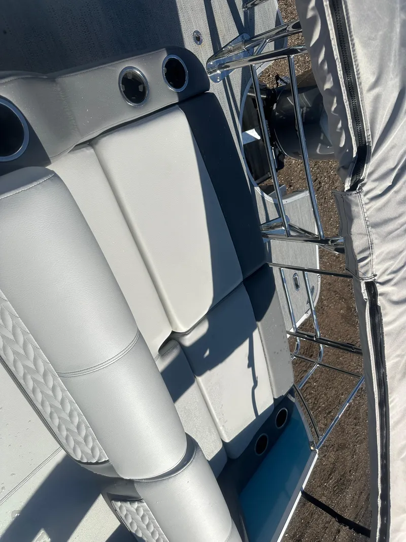 Slide: The Image of 2025 Godfrey Monaco 235 DFL Tritoon interior seating and railing detail. - 25