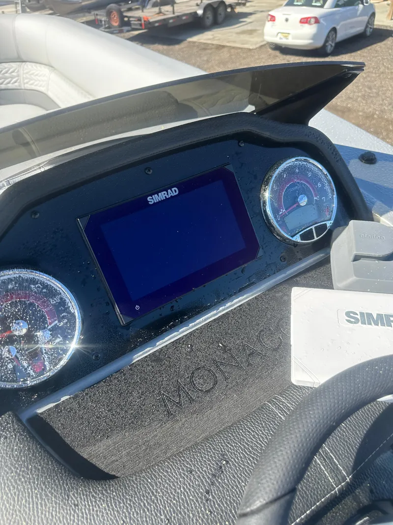 Slide: The Image of Dashboard of 2025 Godfrey Monaco 235 DFL Tritoon with Simrad display. - 32