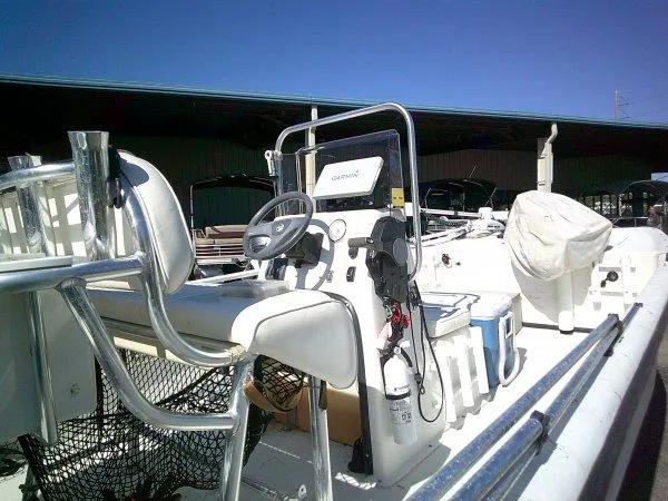 Slide: The Image of 2018 Carolina Skiff 198 DLX boat interior with steering console and seating. - 5