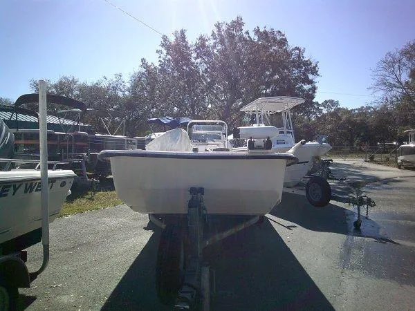 Slide: The Image of 2018 Carolina Skiff 198 DLX boat on trailer in outdoor lot. - 8