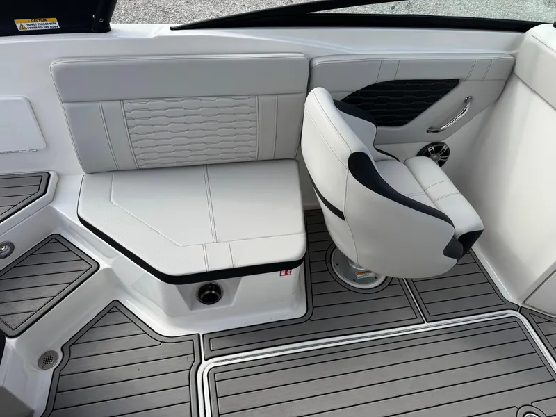 Slide: The Image of 2025 Sea Ray SPX 230 boat interior with gray seating and modern design. - 10
