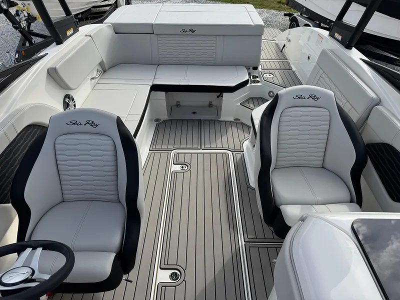 Slide: The Image of 2025 Sea Ray SPX 230 boat interior with stylish seating and modern design. - 11