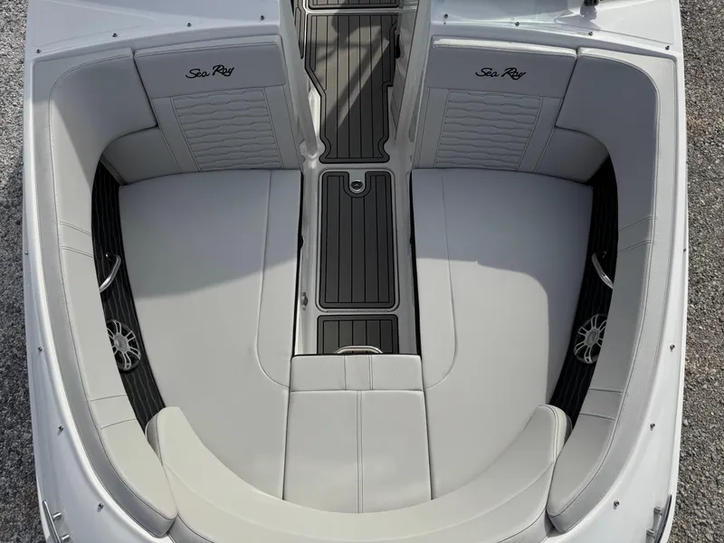 Slide: The Image of 2025 Sea Ray SPX 230 boat interior with sleek seating and modern design. - 15