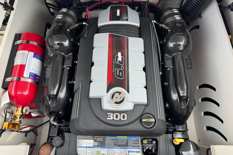 Slide: The Image of Engine compartment of 2025 Sea Ray SPX 230 with 6.2L 300 HP engine and fire extinguisher. - 17