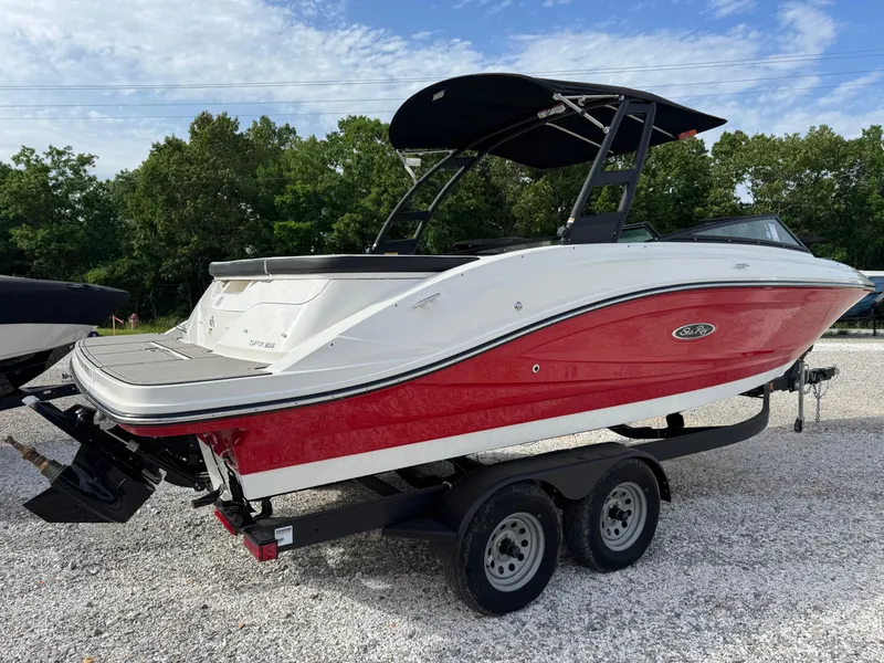 Slide: The Image of 2025 Sea Ray SPX 230 boat with red and white hull on a trailer. - 3