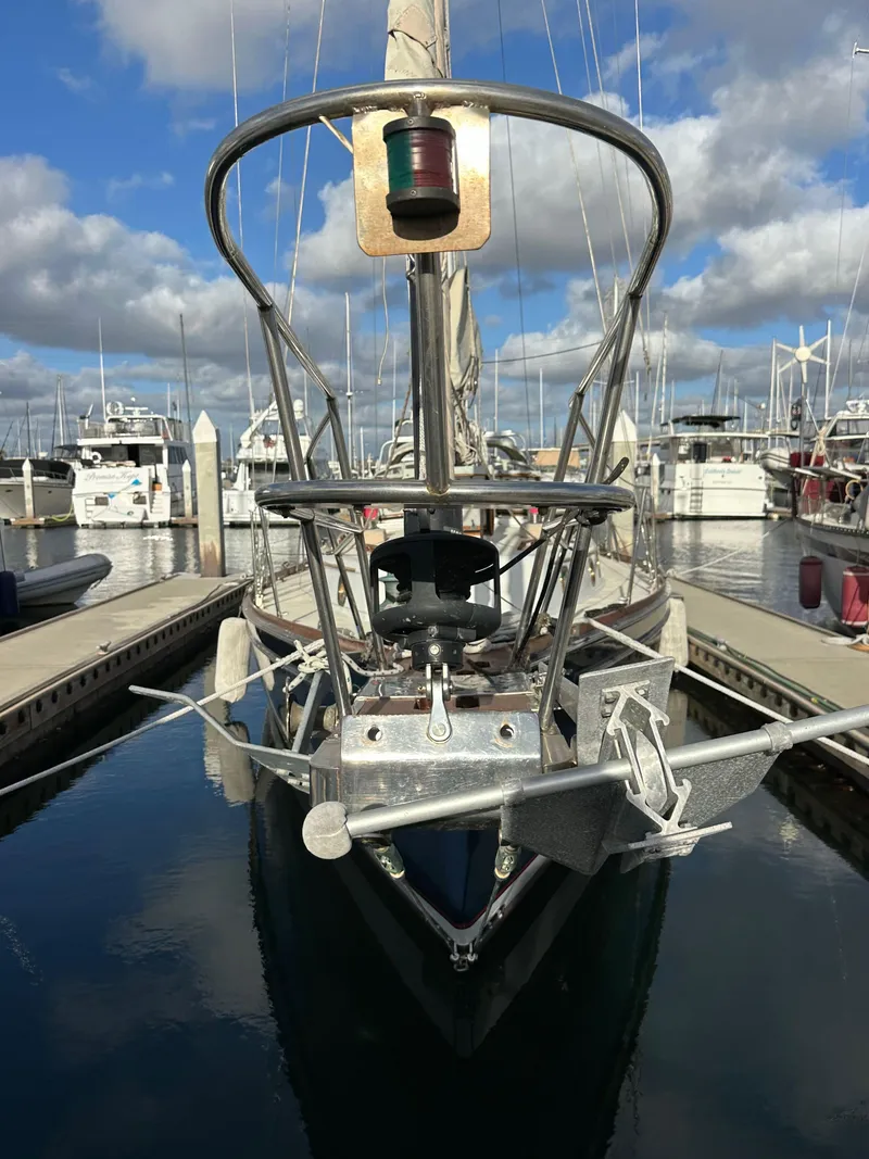 Slide: The Image of 1985 Shannon 43 Classic Cutter docked in marina, clear sky, calm water. - 12